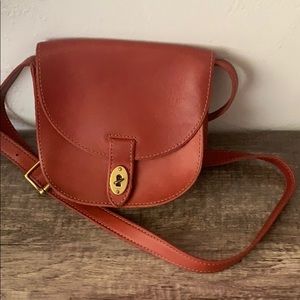 Fossil red crossbody with adjustable strap.